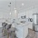 Kitchen with stainless steel appliances and white countertops
