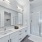 Spacious bathroom with dual sink vanity and shower